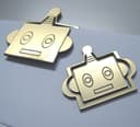 Diseño Vectorial de Sujetapapeles Cabeza de Robot para Láser